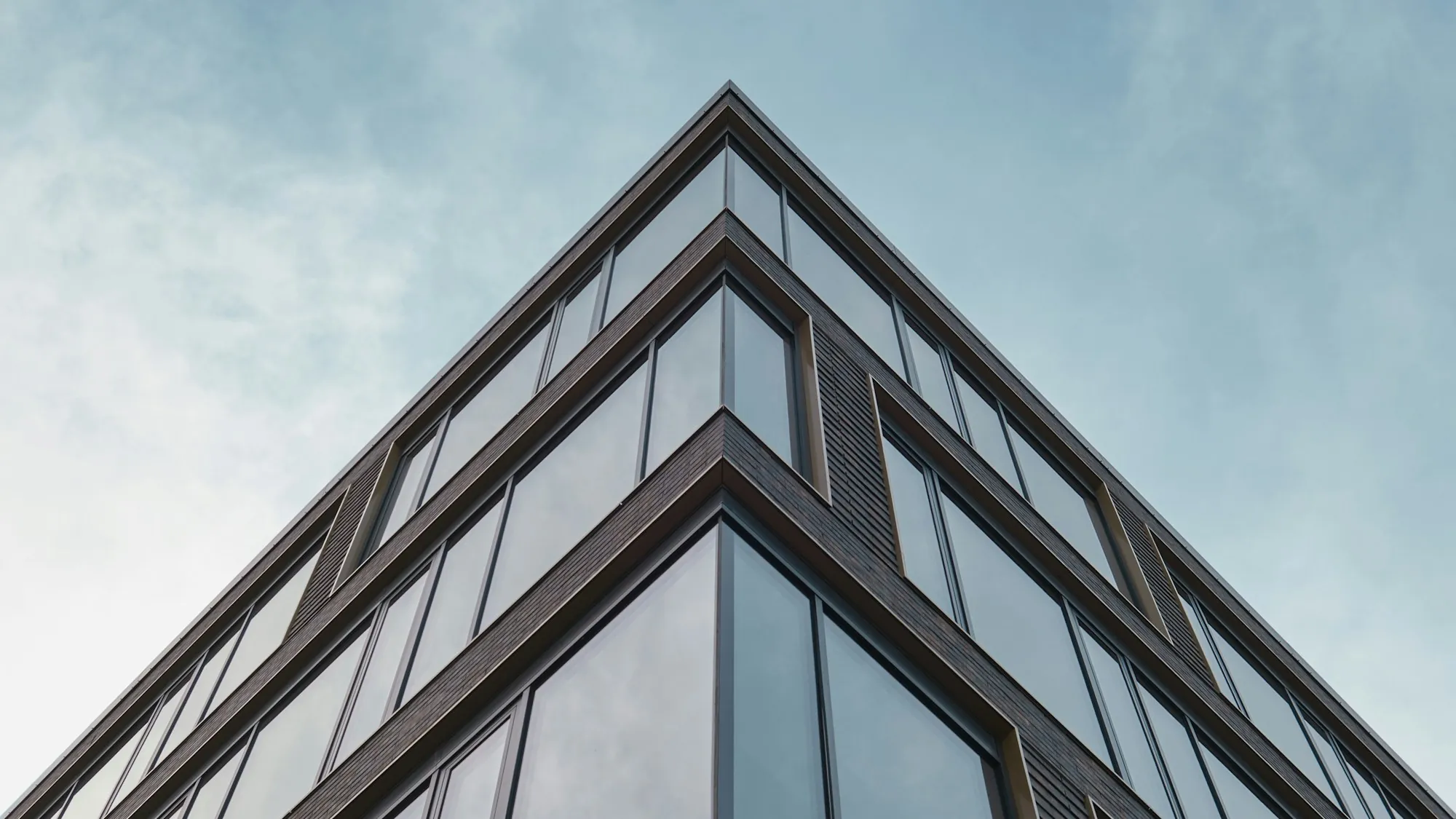 Angular office building facade with framed windows